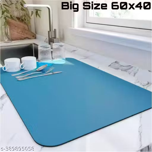 Blue placemat on a kitchen counter with cutlery and cups, labeled 'Big Size 60x40'.
